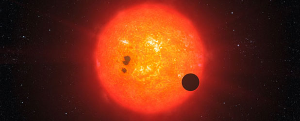 Ilustrasi transit planet GJ1214b pada bintang. Kredit : ESO/L. Calçada