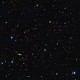 Galaksi-galaksi jauh yang diamati dirasi Cetus yang saat remaja melahap galaksi lebih kecil. Kredit : ESO/CFHT